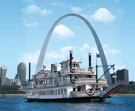 River boat casino with St. Louis skyline and St. Louis Arch in background.
