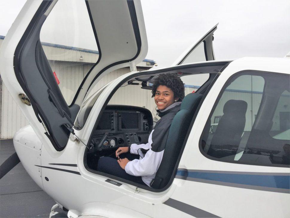Teen In Cockpit of Small Airplane