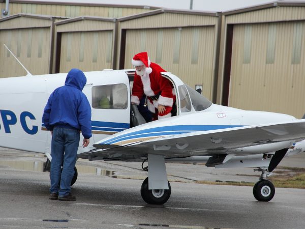 Santa Exits Airplane