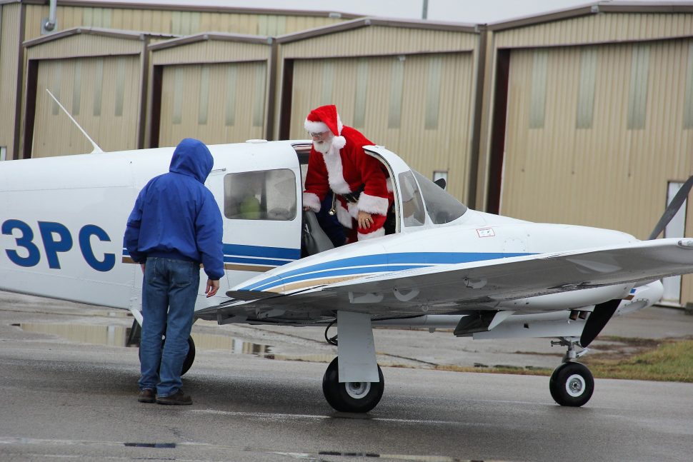 Santa Exits Airplane