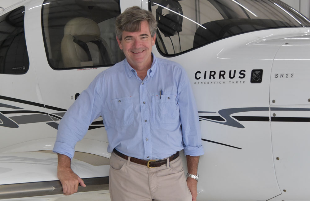 Bill Macon of Ideal Aviation standing in front of a plane.