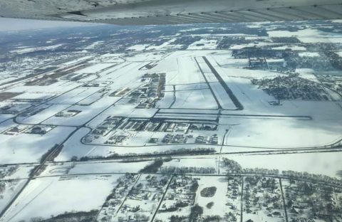 St. Louis Downtown airport during a winter strorm overhead view with snow everywhere.