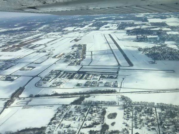 St. Louis Downtown airport during a winter strorm overhead view with snow everywhere.
