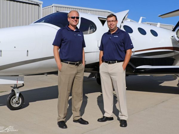 Corey Tomczak and Josh Vinson of Gateway Jets posing with a plane.