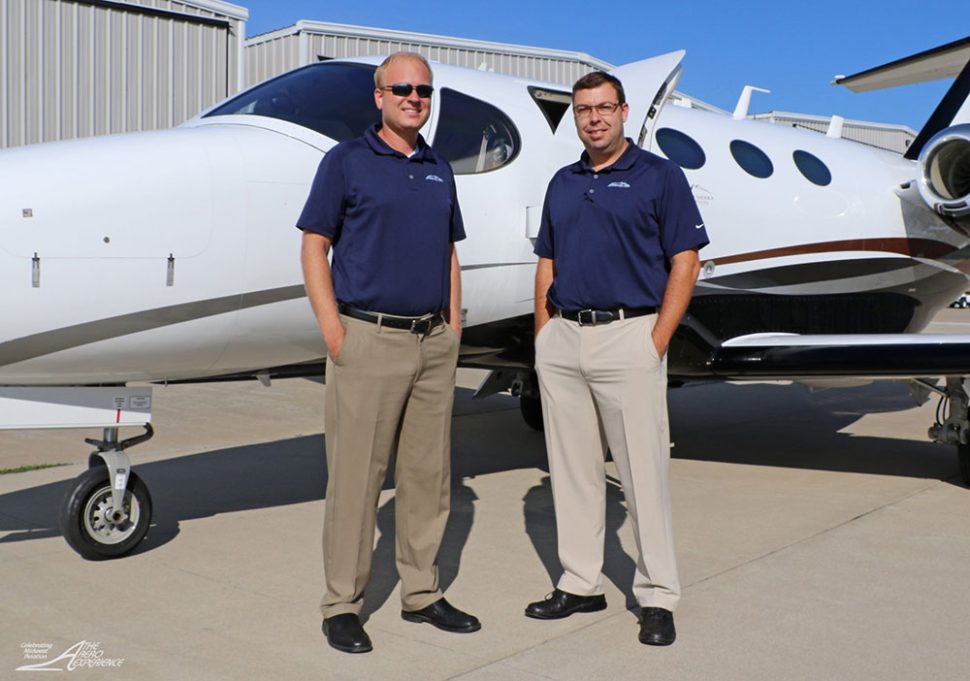 Corey Tomczak and Josh Vinson of Gateway Jets posing with a plane.