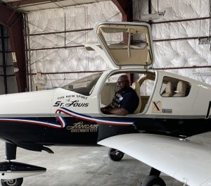 Participant in Aviation Day for Educators sitting inside of a plane