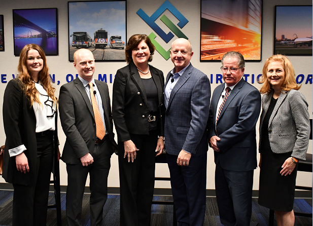 Group photo of five airport directors and Mary Lamie, BSD EVP of Multimodal Services