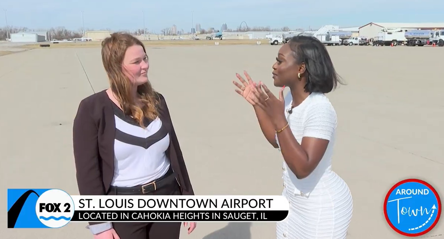 Photo of Airport Director Sandra Shore talking to Britney from KTVI Fox 2 on the tarmac at St. Louis Downtown Airport
